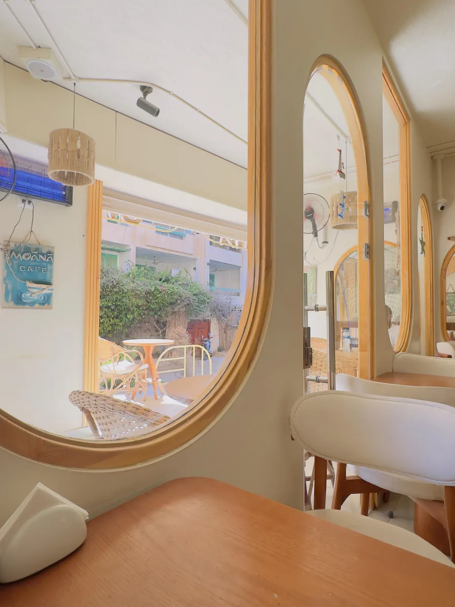 Moānā Café interior, arched mirror overlooking the terrace